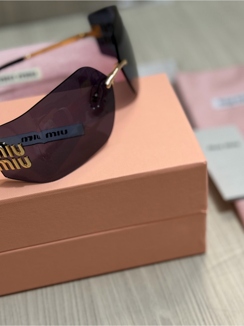 Miu Miu Purple Lens Frameless Sunglasses with Gold Accent
